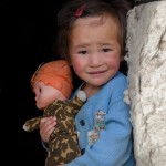 Kirgyz Nomadic girl and Yurts in Alichur Valley, Pamir highway